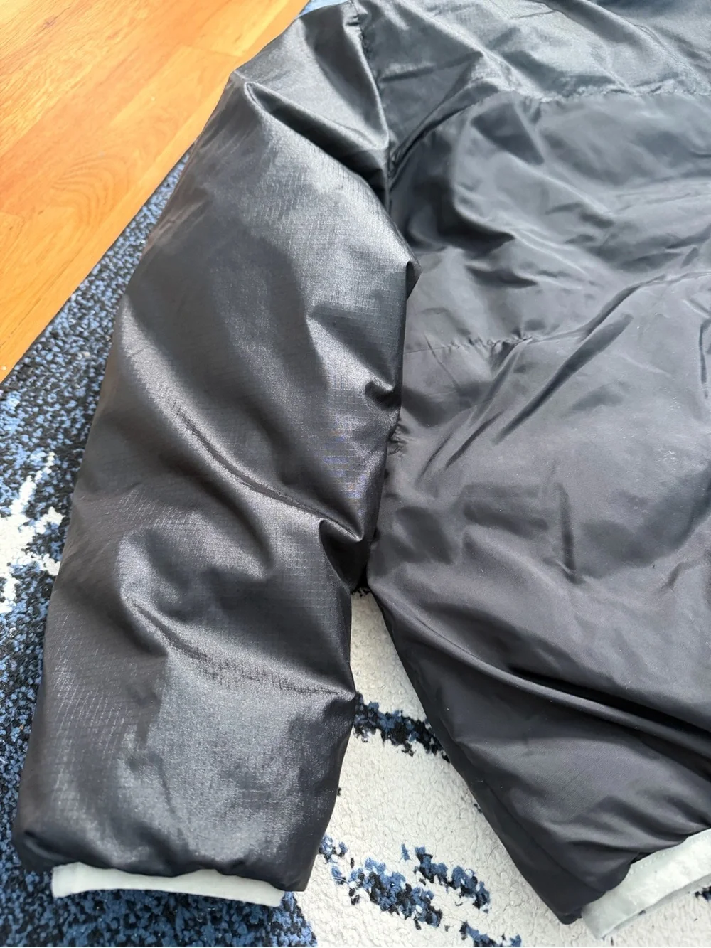 The North Face Kids Black Hooded Puffer Jacket with Light Gray Trim